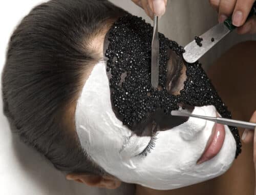 Caviar being applied to a lady's face.